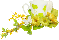 a white cup with green flowers and yellow flowers on it