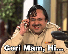 a man in a police uniform is talking on a cell phone and says gori mam hi ...