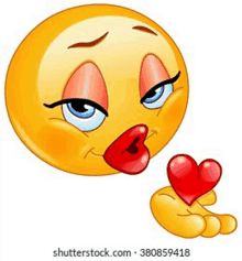 a female smiley face is blowing a kiss while holding a heart .