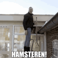 a man standing on a ladder holding a shovel with the words hamsteren written above him