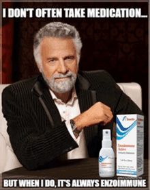 a man with a beard is sitting in front of a box of enzoimmune active