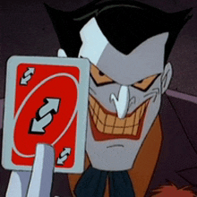 the joker is holding a red uno card