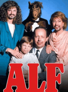 a group of people are posing for a picture with the word alf in red