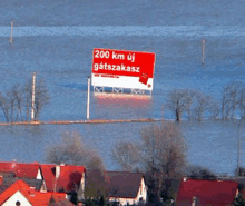 a flooded area with a red sign that says 200 km