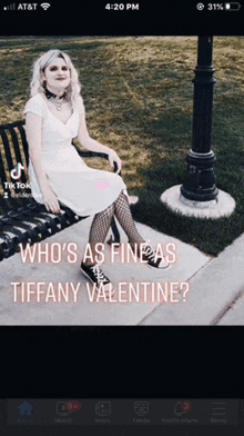 a woman in a white dress is sitting on a bench with the words who 's as fine as tiffany valentine