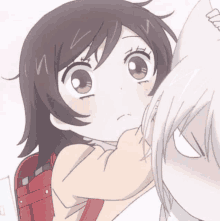 a girl with a red backpack is next to a boy with white hair .