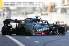 a race car with the word cognizant on the side of it