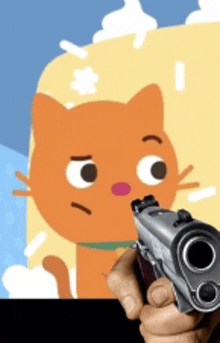 a person is pointing a gun at a cat