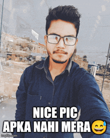 a young man wearing glasses takes a selfie with a caption that reads nice pic apka nahi mera