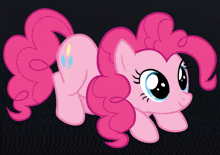 pinkie pie from my little pony is laying down on the ground