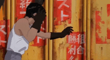 a man in a white tank top is standing in front of a wall with chinese writing on it