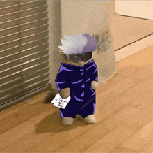 a cat wearing a purple jacket and glasses holds a piece of paper that says " i love you "