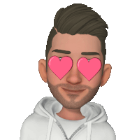 a man with hearts in his eyes is wearing a white sweatshirt