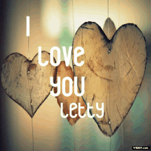 two wooden hearts with the words i love you letty written on them