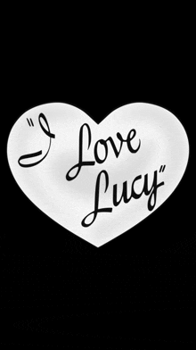 a white heart with the words " i love lucy " on it