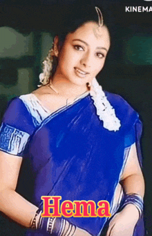 a woman in a blue saree with the name hema written on it