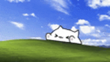 a cartoon cat is sitting on top of a grassy hill .