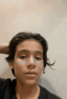 a young boy with a purple lightning bolt on his face