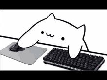 a cartoon cat is sitting at a desk next to a mouse and keyboard .