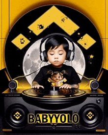 a baby wearing headphones is playing a record on a turntable that says babyolo on it