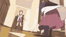 a girl in a purple skirt stands next to a man in a white shirt in a hallway