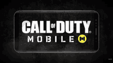 a call of duty mobile logo is displayed on a cell phone