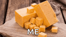 a block of cheese is sitting on a wooden cutting board with the words `` me '' written on it .