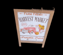 a sign that says farm fresh harvest market open daily pumpkin patch