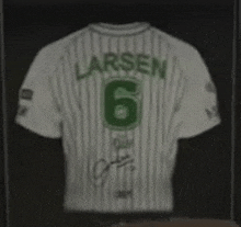 a larsen jersey is displayed in a glass case