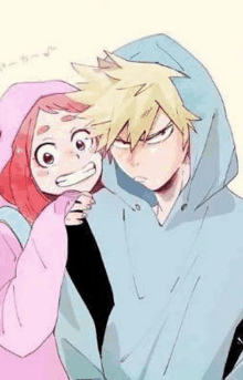 a boy and a girl are standing next to each other . the girl is wearing a pink hoodie .