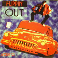 a man is standing on top of a red car with the words flippin ' out on it