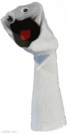 a white sock puppet has googly eyes and a red tongue sticking out