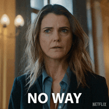 a woman in a suit says no way in front of her face