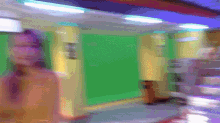 a blurry picture of a person walking in a hallway