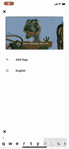 a phone screen shows a picture of a dinosaur and a keyboard