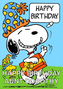 a cartoon of snoopy holding a gift box and saying happy birthday aunt dorothy