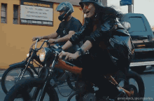 a man and a woman are riding motorcycles in front of a yellow building with a sign that says centro mexico