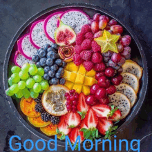 a plate of fruit with the words good morning written in blue