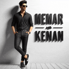 a man in a black shirt stands in front of a wall that says memar konan