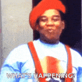 a man wearing a red hat and overalls is asking what 's happening ?