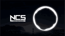 a man stands in front of a glowing circle that says ncs on it