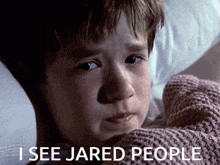 a young boy is laying in bed with the words " i see jared people " next to him