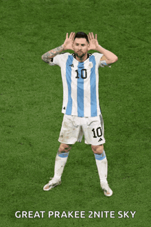 a soccer player with the number 10 on his jersey stands on the field