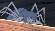 a cartoon spider is crawling along a wooden surface .