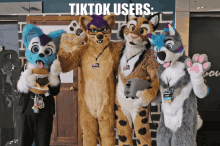 a group of furry costumes standing next to each other with the words tiktok users written above them