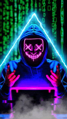 a man in a hoodie with a neon mask on