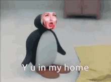 a penguin with a woman 's face on it and the words yu in my home below it