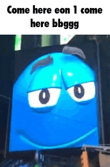 a blue cartoon character with a face on a screen .