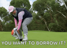 an elderly woman is using a blower on a golf course with the words " you want to borrow it " below her