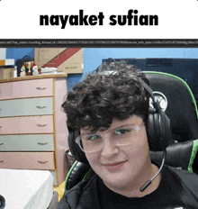 a person wearing headphones and glasses with the name nayaket sufian on the top